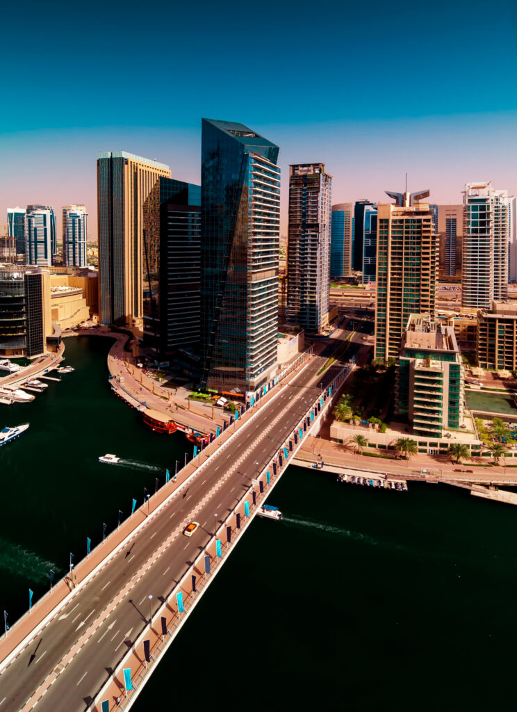 Amazing colorful dubai marina skyline with water canal during sunny day, Dubai, United Arab Emirates.